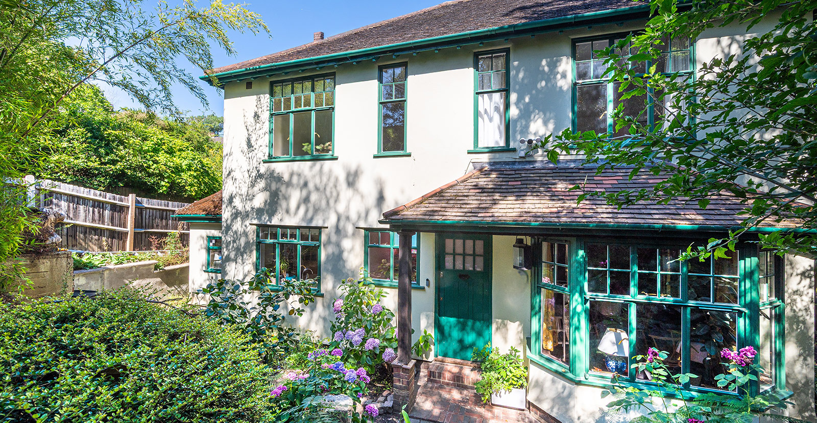 Bespoke green steel windows and doors for Art Deco style London home