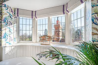Beautiful bathroom with white leaded EB20 steel windows.