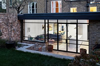 A striking Clement EB24 steel door screen adds a contemporary edge to this London extension. Photography: GG Archard.