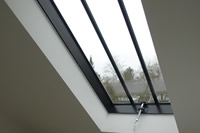 A bespoke Clement Conservation Rooflight, floods plenty of natural light into this bathroom.