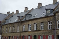 This building has been restored using a variety of Clement Conservation rooflights in slate profile.