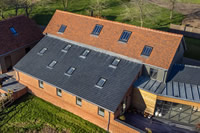 A combination of both slate and tile profile Clement Conservation Rooflights were used for this 250-year-old listed barn conversion in Essex.