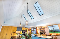 A row of Clement Conservation Rooflights bringing masses of natural light into this stunning kitchen.