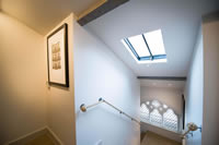 Natural light floods through this Clement rooflight which is fitted with a brass hand winder.