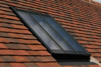 No 'shoebox' effect here, just a beautifully flush rooflight in a tile roof.