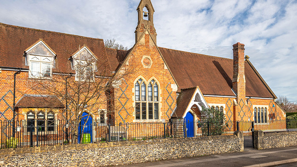 A combination of intricately shaped head windows manufactured by Clement for historic school