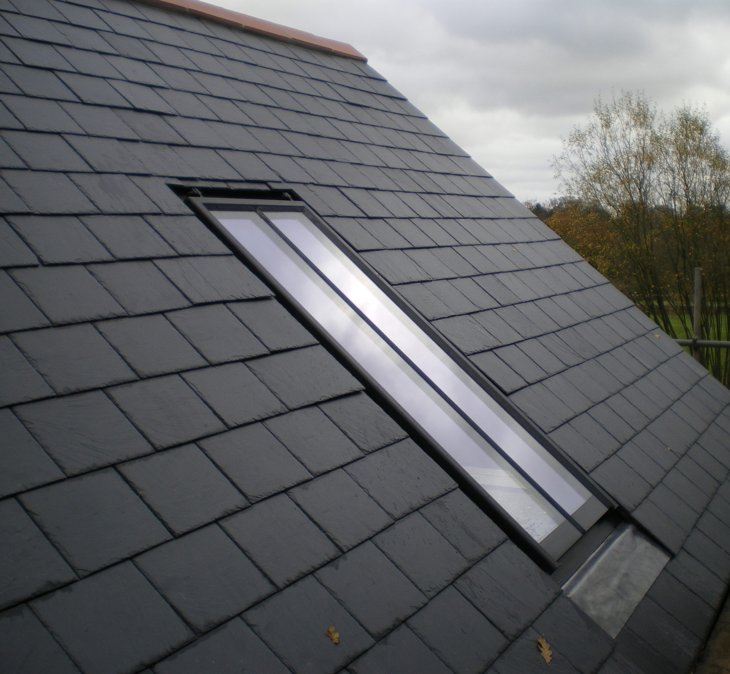 Image of a Clement Conservation Rooflight in a slate roof.