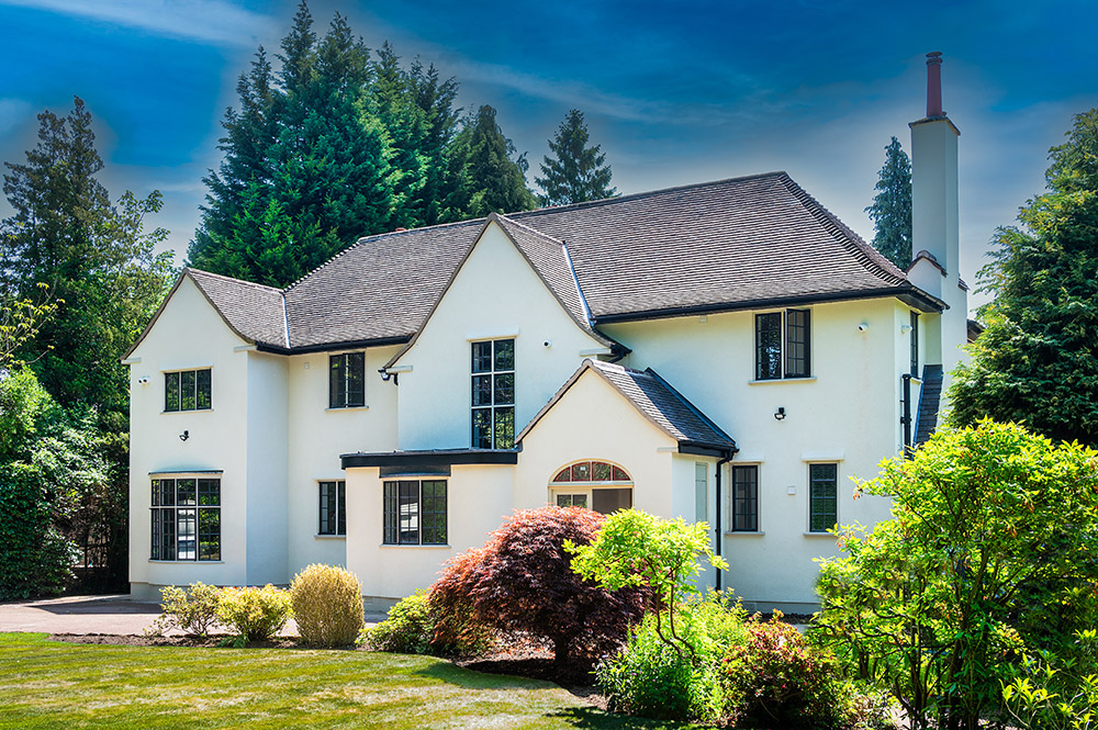Dual colour steel windows from the Clement EB20 range complement this beautiful Arts and Crafts style house.