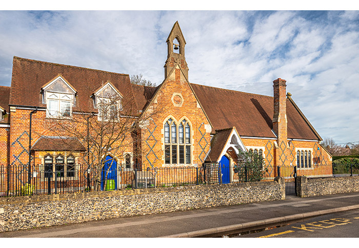 Various shaped steel windows crafted for historic school 